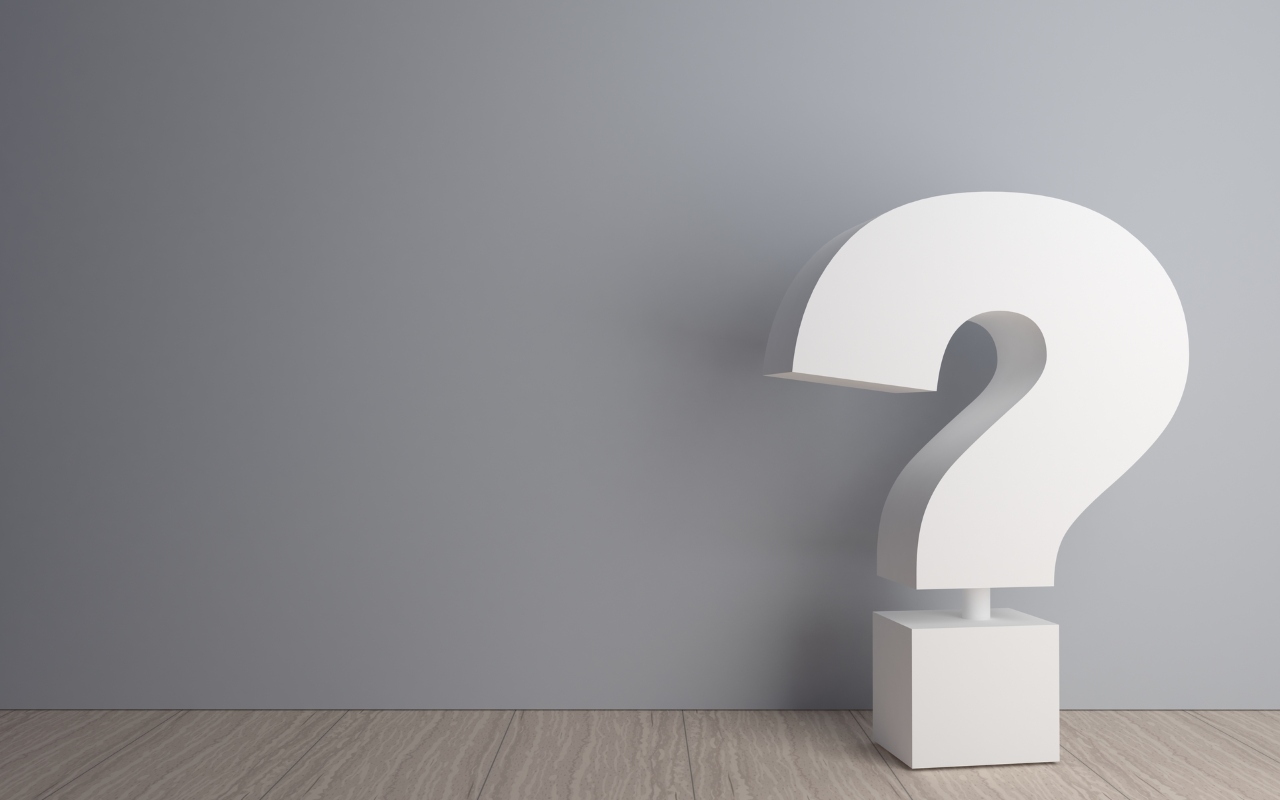 big question mark in a room with grey wall